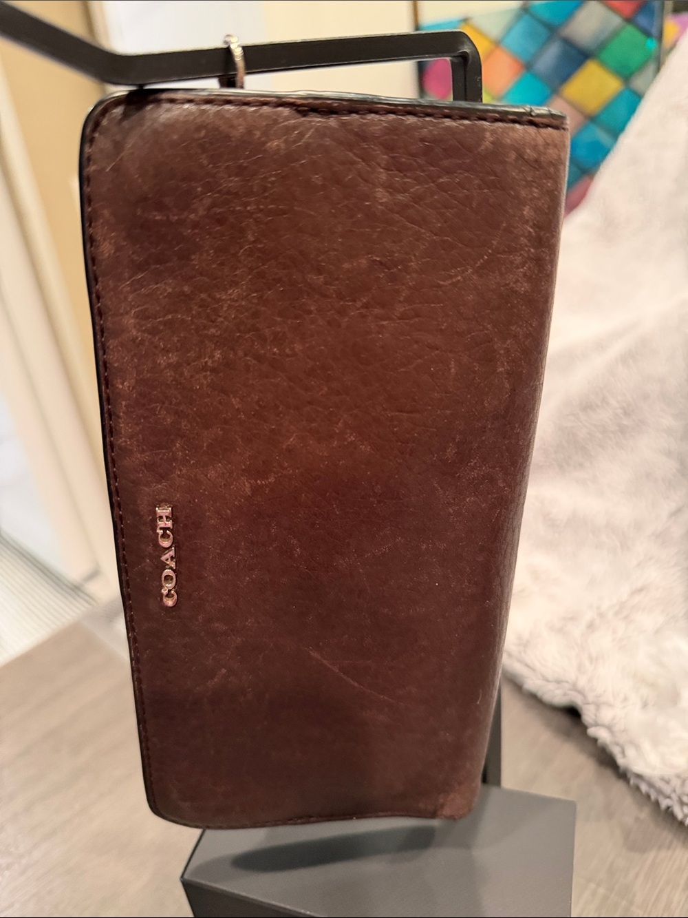 Coach Dark Brown Leather Wallet with snap closure.